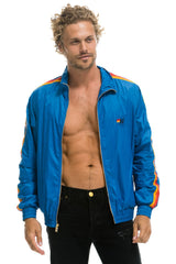 MEN'S 4 STRIPE WINDBREAKER - SNORKEL BLUE