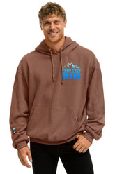 PALM TREE FESTIVAL ASPEN 2025 PULLOVER HOODIE RELAXED - BROWN