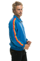 MEN'S 4 STRIPE WINDBREAKER - SNORKEL BLUE