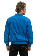 MEN'S 4 STRIPE WINDBREAKER - SNORKEL BLUE