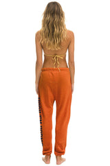 UNIVERSITY OF TEXAS UNISEX CIRCLE PRINT SWEATPANTS - BURNT ORANGE