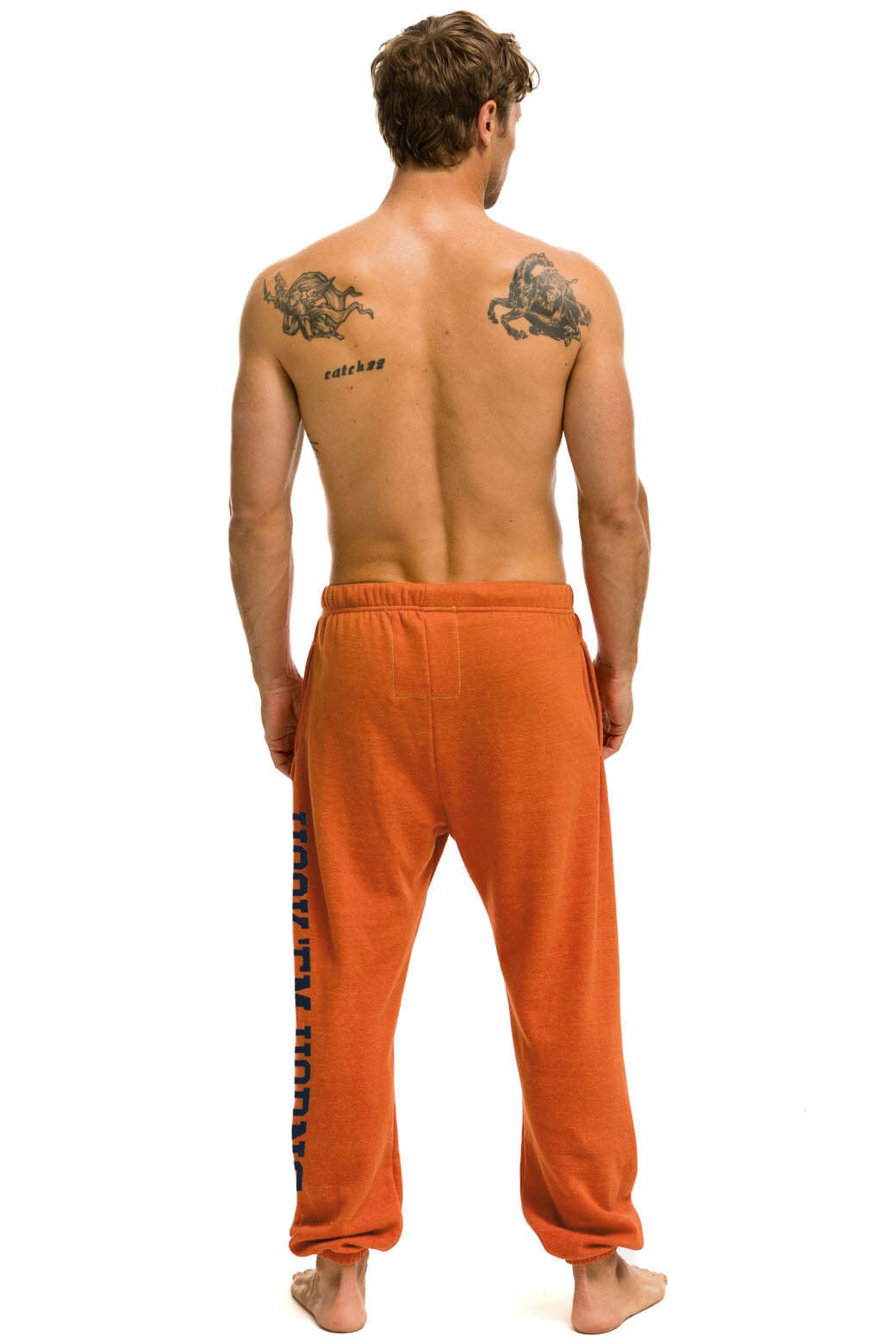 UNIVERSITY OF TEXAS UNISEX CIRCLE PRINT SWEATPANTS - BURNT ORANGE